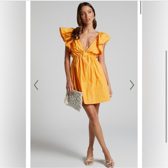 Showpo. Dresses & Skirts - SHOWPO Raiza Ruffle Sleeve Tie Back Plunge Mini Dress